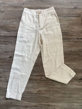 a new day Off-White High-Rise Pleated Tapered Pants